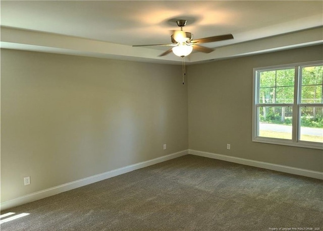 2312 Smith Rd, Hope Mills, NC 28348 - unfurnished room with dark colored carpet, ceiling fan, and baseboards