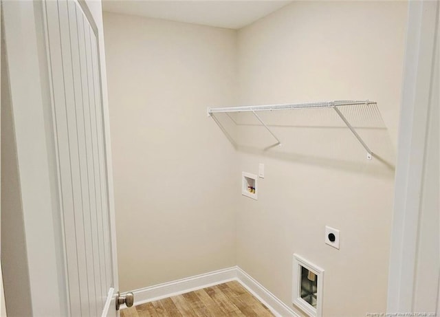 2312 Smith Rd, Hope Mills, NC 28348 - laundry room featuring hookup for a washing machine, light wood-style flooring, electric dryer hookup, and baseboards