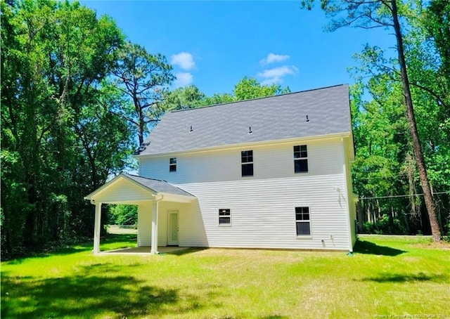 2312 Smith Rd, Hope Mills, NC 28348 - rear view of property with a lawn and a patio