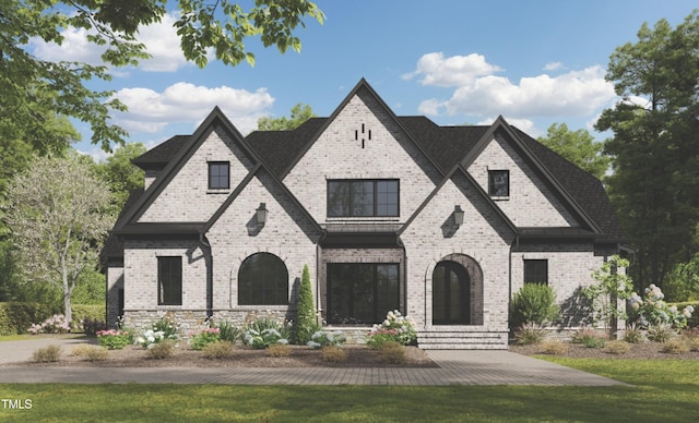 3422 Redbud Ln, Raleigh, NC 27607 - french provincial home featuring brick siding, a front lawn, and roof with shingles