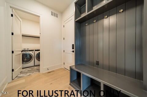 3422 Redbud Ln, Raleigh, NC 27607 - mudroom featuring washer and dryer, light wood-type flooring, and baseboards