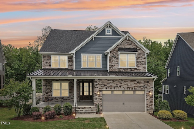 421 Gilpin Way, Cary, NC 27519 - craftsman-style house featuring covered porch, a garage, concrete driveway, a standing seam roof, and stone siding