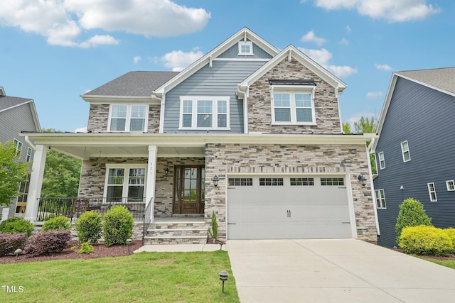 421 Gilpin Way, Cary, NC 27519 - craftsman inspired home featuring stone siding, an attached garage, driveway, a porch, and a front lawn