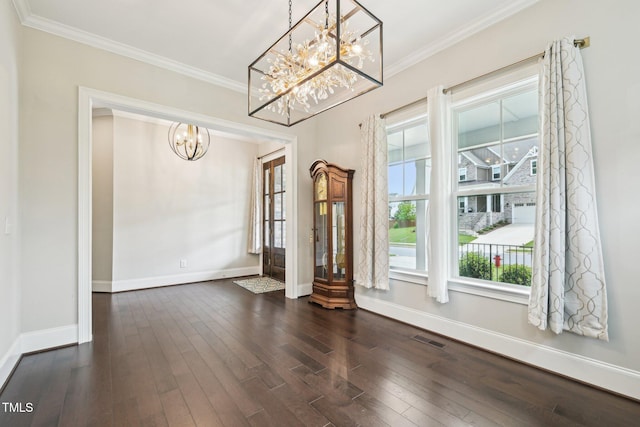 421 Gilpin Way, Cary, NC 27519 - unfurnished dining area featuring a chandelier, baseboards, ornamental molding, and dark wood-style floors