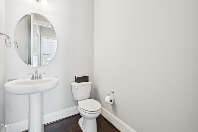 421 Gilpin Way, Cary, NC 27519 - bathroom with baseboards, toilet, and wood finished floors