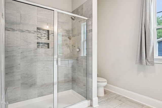 421 Gilpin Way, Cary, NC 27519 - bathroom with baseboards, toilet, and a shower stall