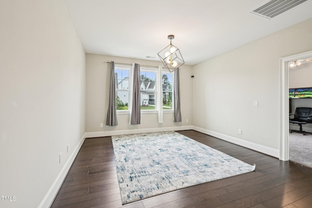 421 Gilpin Way, Cary, NC 27519 - dining area featuring dark wood finished floors, baseboards, and a chandelier