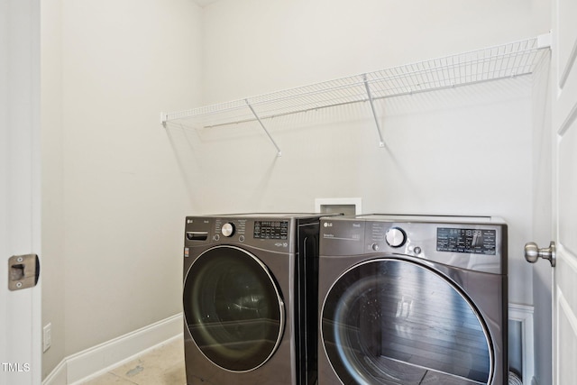 421 Gilpin Way, Cary, NC 27519 - washroom featuring independent washer and dryer, baseboards, and tile patterned flooring