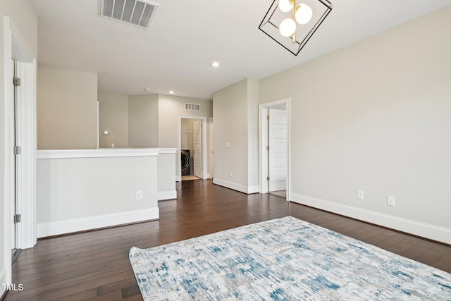 421 Gilpin Way, Cary, NC 27519 - empty room featuring washer / dryer, dark wood-type flooring, baseboards, and recessed lighting
