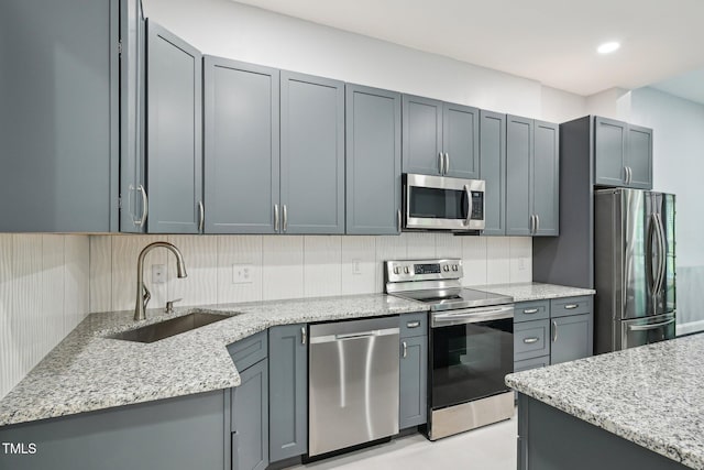 421 Gilpin Way, Cary, NC 27519 - kitchen with appliances with stainless steel finishes, a sink, light stone countertops, tasteful backsplash, and recessed lighting