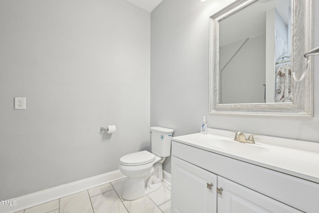 421 Gilpin Way, Cary, NC 27519 - half bathroom featuring baseboards, vanity, toilet, and marble look tile flooring