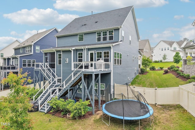421 Gilpin Way, Cary, NC 27519 - rear view of property featuring a trampoline, a residential view, stairs, and a wooden deck