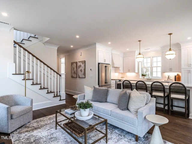 2641 Sidford Aly, Raleigh, NC 27608 - living area with dark wood-style flooring, stairs, ornamental molding, recessed lighting, and baseboards