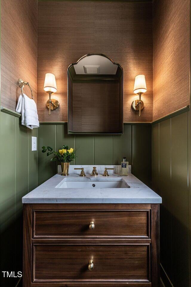 2641 Sidford Aly, Raleigh, NC 27608 - bathroom with a decorative wall, vanity, and wallpapered walls