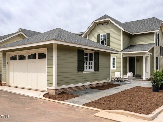 2641 Sidford Aly, Raleigh, NC 27608 - view of front of home with an attached garage and a shingled roof