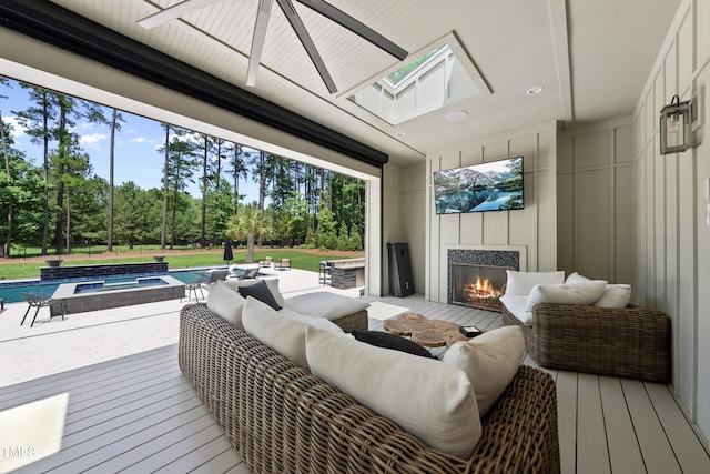 7545 Hasentree Club Dr, Wake Forest, NC 27587 - deck with an outdoor living space with a fireplace, ceiling fan, an in-ground hot tub, an outdoor pool, and view of scattered trees
