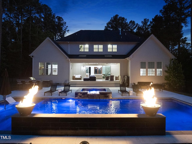 7545 Hasentree Club Dr, Wake Forest, NC 27587 - rear view of property featuring area for grilling, an outdoor living space with a fire pit, an in-ground hot tub, an outdoor pool, and a patio