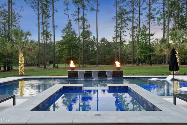 7545 Hasentree Club Dr, Wake Forest, NC 27587 - pool at dusk with an in-ground hot tub, an outdoor pool, and a yard