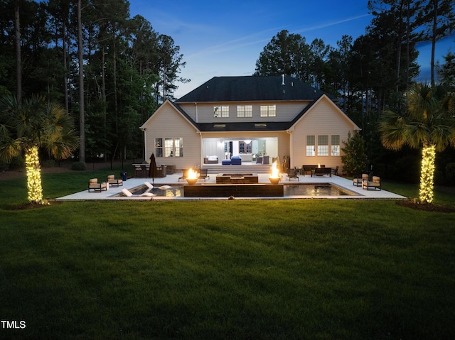 7545 Hasentree Club Dr, Wake Forest, NC 27587 - rear view of house featuring an outdoor living space with a fire pit, a patio, and a yard