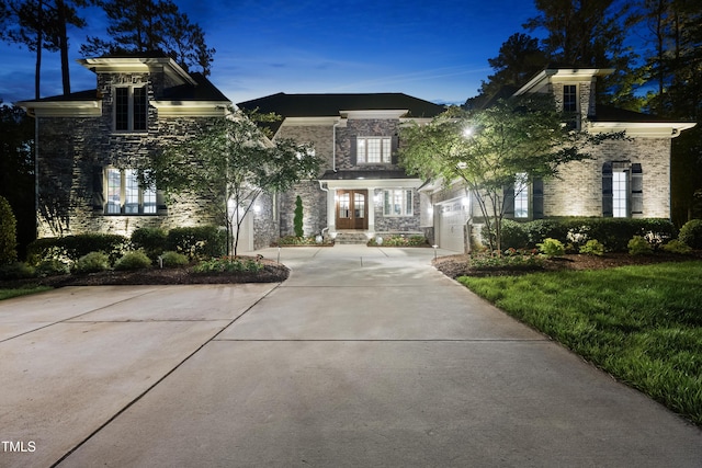 7545 Hasentree Club Dr, Wake Forest, NC 27587 - view of front of property with stone siding, concrete driveway, and french doors