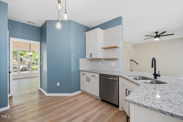 121 River Hills Dr, Clayton, NC 27527 - kitchen featuring stainless steel dishwasher, a sink, white cabinetry, open shelves, and light wood-style flooring