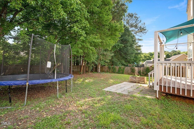 121 River Hills Dr, Clayton, NC 27527 - view of yard featuring a trampoline, a patio area, and a deck