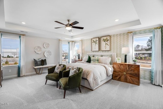 1021 Dillon Lake Dr, Knightdale, NC 27545 - bedroom with a raised ceiling, baseboards, multiple windows, light colored carpet, and recessed lighting
