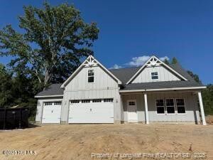 540 Harrow Dr, Carthage, NC 28327 - modern inspired farmhouse featuring a porch and dirt driveway