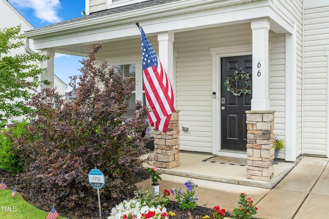 66 Arlie Ln, Lillington, NC 27546 - doorway to property featuring a porch and a shingled roof
