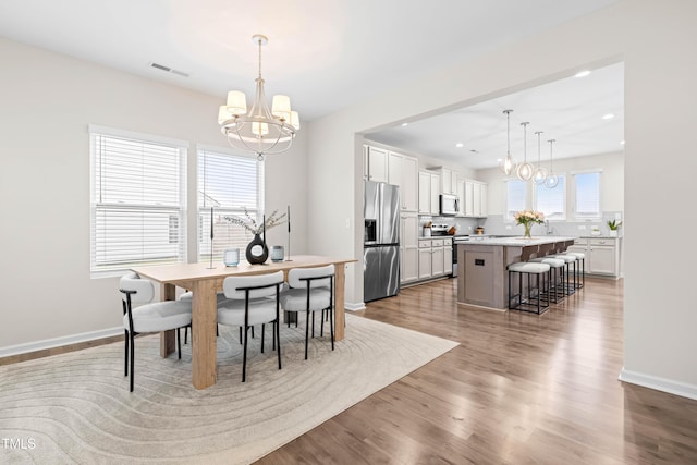 66 Arlie Ln, Lillington, NC 27546 - dining room featuring a chandelier, light wood-style floors, baseboards, and recessed lighting