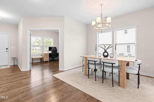 66 Arlie Ln, Lillington, NC 27546 - dining area featuring a chandelier, wood finished floors, a desk, and baseboards