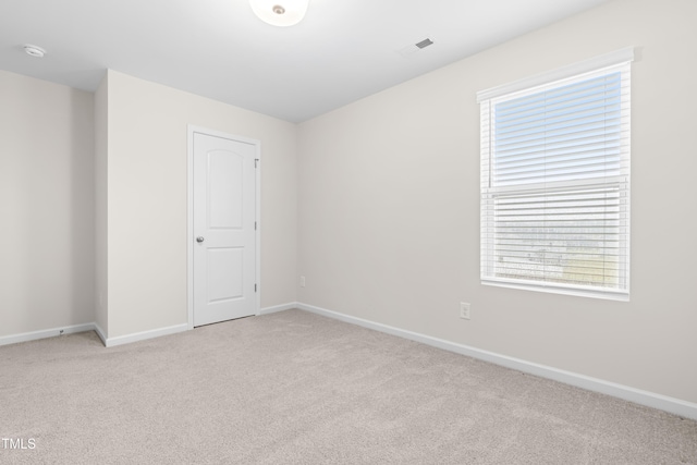 66 Arlie Ln, Lillington, NC 27546 - empty room featuring light carpet, healthy amount of natural light, and baseboards
