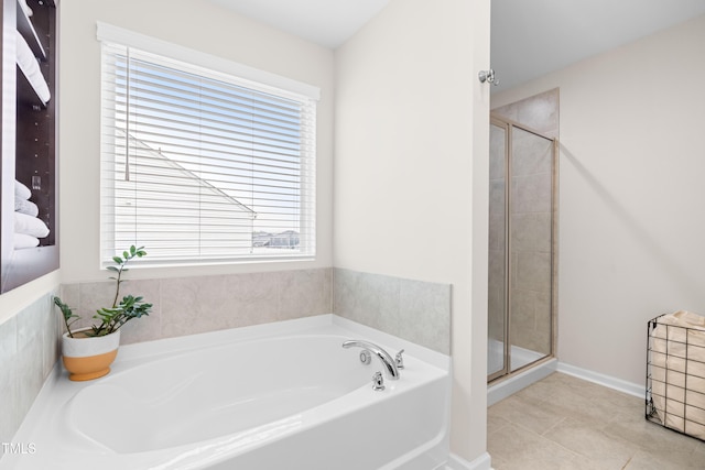 66 Arlie Ln, Lillington, NC 27546 - bathroom with a bath, a stall shower, and tile patterned flooring