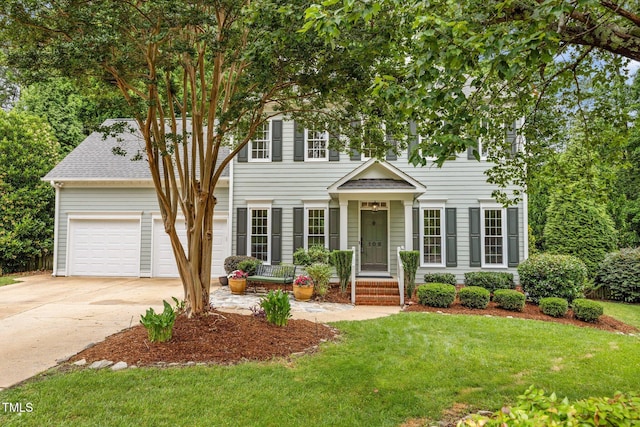 106 Fawley Ct, Cary, NC 27519 - colonial home with driveway, a front lawn, and a garage