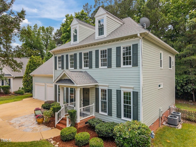 106 Fawley Ct, Cary, NC 27519 - colonial home featuring driveway, a shingled roof, a garage, and central AC unit