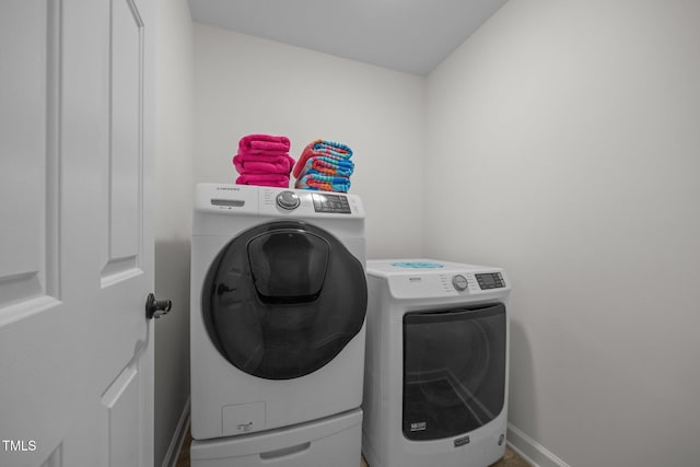 106 Fawley Ct, Cary, NC 27519 - laundry area with separate washer and dryer and baseboards