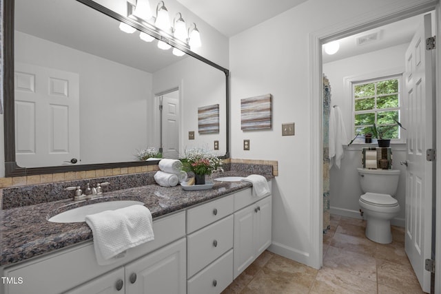 106 Fawley Ct, Cary, NC 27519 - full bath with double vanity, toilet, baseboards, and a shower with shower curtain