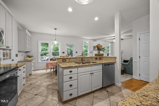 106 Fawley Ct, Cary, NC 27519 - kitchen with a sink, stainless steel appliances, baseboards, white cabinetry, and recessed lighting