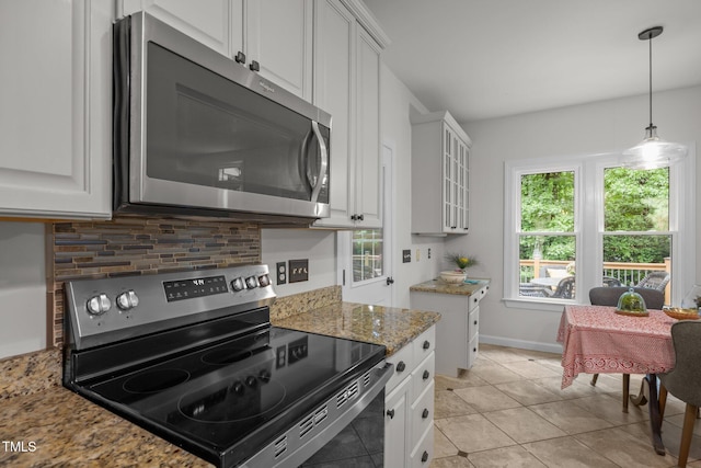 106 Fawley Ct, Cary, NC 27519 - kitchen with stainless steel appliances, backsplash, white cabinets, and light tile patterned floors