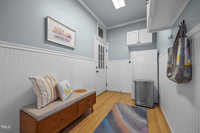 106 Fawley Ct, Cary, NC 27519 - sitting room featuring light wood finished floors, wainscoting, and crown molding