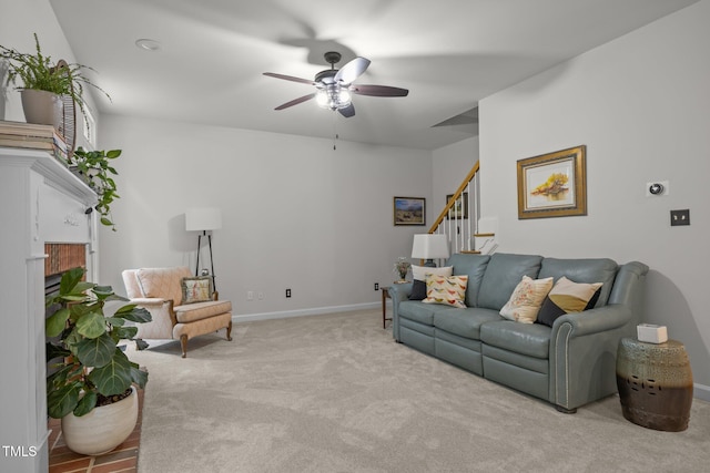 106 Fawley Ct, Cary, NC 27519 - carpeted living area with a ceiling fan, stairs, baseboards, and a fireplace