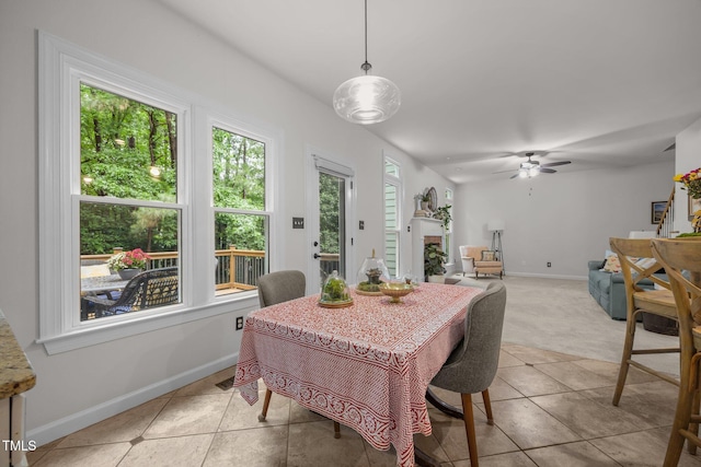106 Fawley Ct, Cary, NC 27519 - dining area featuring ceiling fan, baseboards, light tile patterned flooring, and light carpet