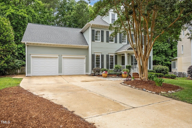 106 Fawley Ct, Cary, NC 27519 - colonial-style house with a porch, an attached garage, roof with shingles, and driveway