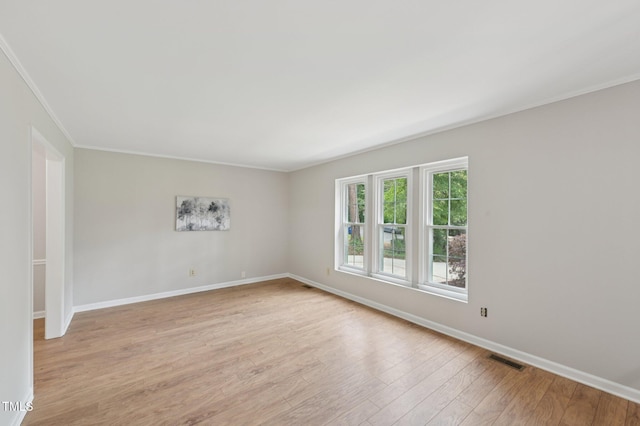 1308 Swallow Dr, Raleigh, NC 27606 - empty room with crown molding, light wood finished floors, and baseboards