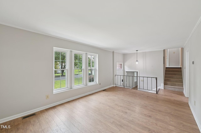 1308 Swallow Dr, Raleigh, NC 27606 - spare room featuring light wood finished floors, baseboards, and crown molding