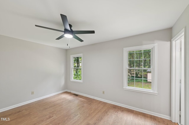 1308 Swallow Dr, Raleigh, NC 27606 - empty room featuring baseboards, a ceiling fan, and light wood finished floors
