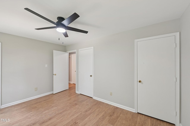 1308 Swallow Dr, Raleigh, NC 27606 - unfurnished bedroom featuring light wood finished floors, baseboards, and a ceiling fan