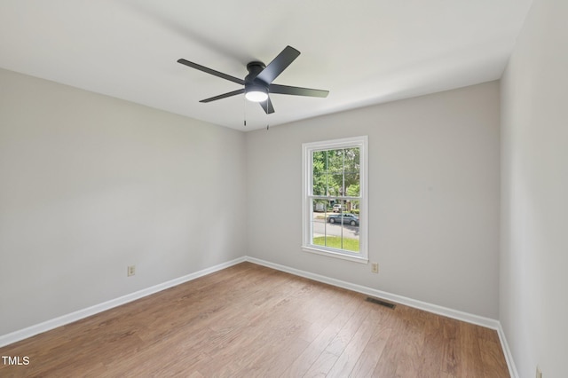 1308 Swallow Dr, Raleigh, NC 27606 - spare room featuring baseboards, light wood-style flooring, and ceiling fan