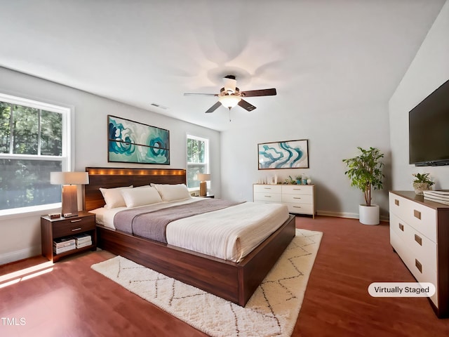 148 Daneborg Rd, Durham, NC 27703 - bedroom with baseboards, a ceiling fan, and wood finished floors