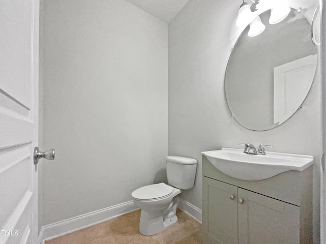 148 Daneborg Rd, Durham, NC 27703 - bathroom with vanity, toilet, baseboards, and tile patterned flooring